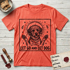 Let Go and Let Dog Rescue Mutt T-Shirt flat lay in Heather Orange, featuring a bold black-and-white woodcut of a haloed scruffy rescue mutt with both front paws raised.