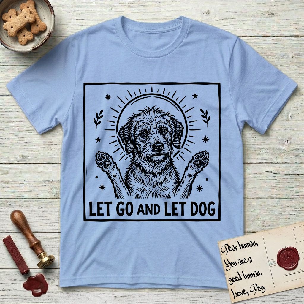 Let Go and Let Dog Rescue Mutt T-Shirt flat lay in Light Blue, featuring a bold black-and-white woodcut of a haloed scruffy rescue mutt with both front paws raised.