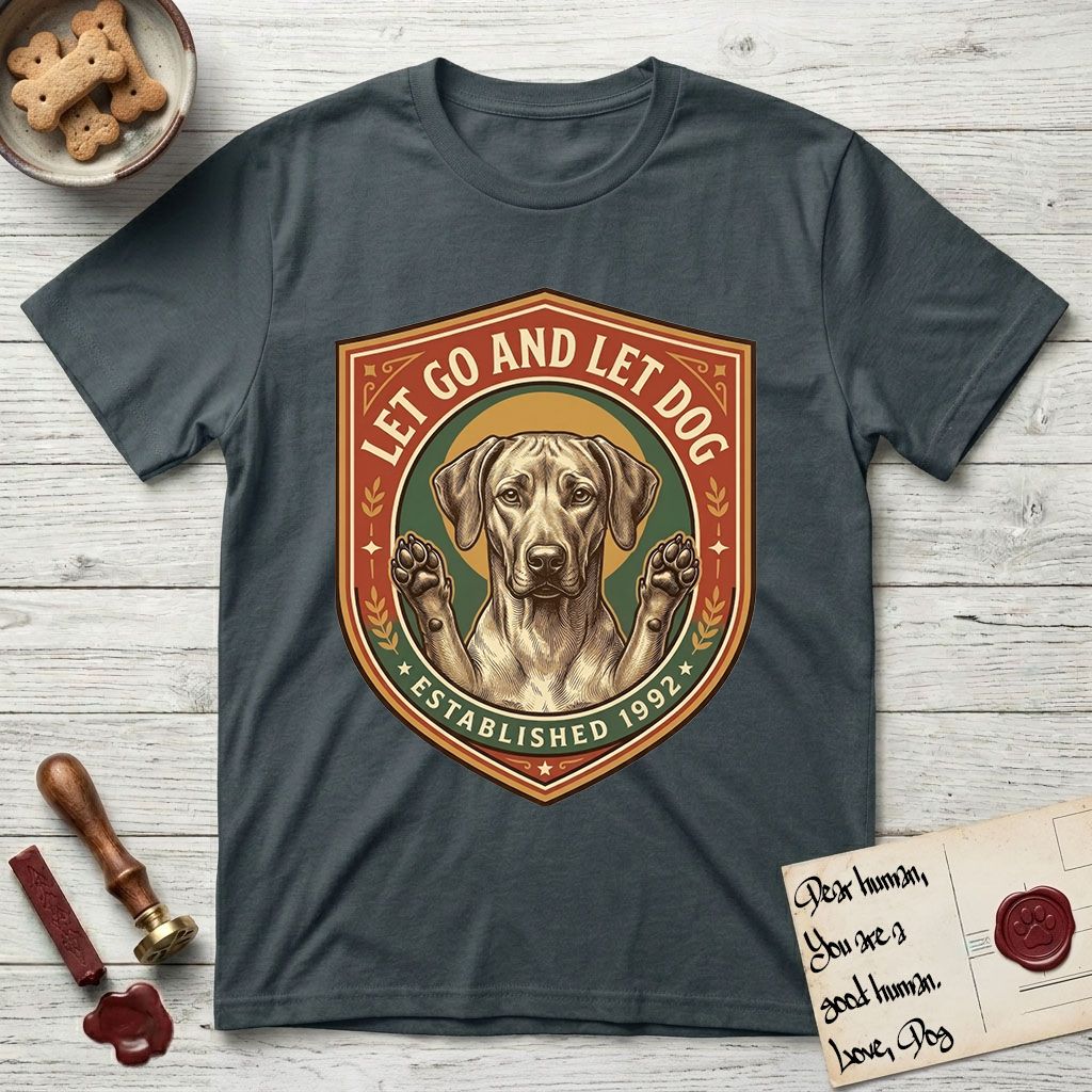 Let Go and Let Dog Rhodesian Ridgeback T-Shirt flat lay in Dark Heather Grey, featuring a vintage engraved crest of a haloed Rhodesian Ridgeback with front paws raised.