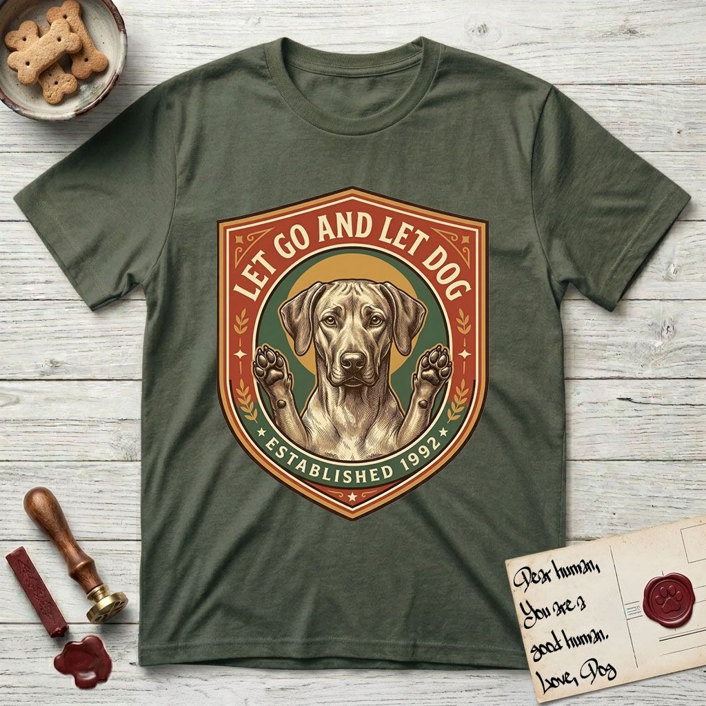Let Go and Let Dog Rhodesian Ridgeback T-Shirt flat lay in Heather Military Green, featuring a vintage engraved crest of a haloed Rhodesian Ridgeback with front paws raised.