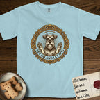 Let Go and Let Dog Schnauzer T-Shirt flat lay in Chambray, featuring an ornate gilded medallion of a haloed Schnauzer with front paws raised.