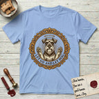 Let Go and Let Dog Schnauzer T-Shirt flat lay in Light Blue, featuring an ornate gilded medallion of a haloed Schnauzer with front paws raised.