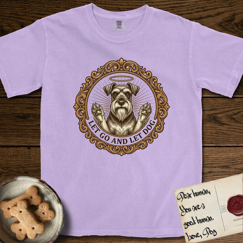 Let Go and Let Dog Schnauzer T-Shirt flat lay in Orchid, featuring an ornate gilded medallion of a haloed Schnauzer with front paws raised.