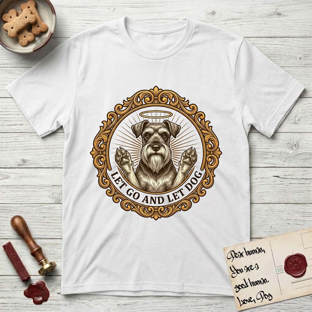 Let Go and Let Dog Schnauzer T-Shirt flat lay in White, featuring an ornate gilded medallion of a haloed Schnauzer with front paws raised.
