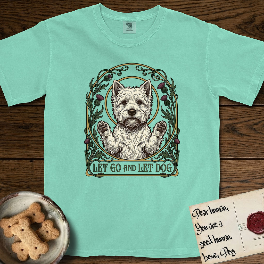 Let Go and Let Dog Westie T-Shirt flat lay in Island Reef, featuring an Art Nouveau arch of thistles and curling vines around a haloed West Highland White Terrier, paws raised.