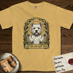 Let Go and Let Dog Westie T-Shirt flat lay in Mustard, featuring an Art Nouveau arch of thistles and curling vines around a haloed West Highland White Terrier, paws raised.