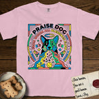 Praise Dog From Whom All Blessings Flow Australian Cattle Dog T-Shirt flat lay in Blossom, featuring a neon pop-art illustration of an abstract Australian Cattle Dog with bold outlined "Praise Dog From Whom All Blessings Flow" lettering.