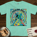 Praise Dog From Whom All Blessings Flow Australian Cattle Dog T-Shirt flat lay in Island Reef, featuring a neon pop-art illustration of an abstract Australian Cattle Dog with bold outlined "Praise Dog From Whom All Blessings Flow" lettering.
