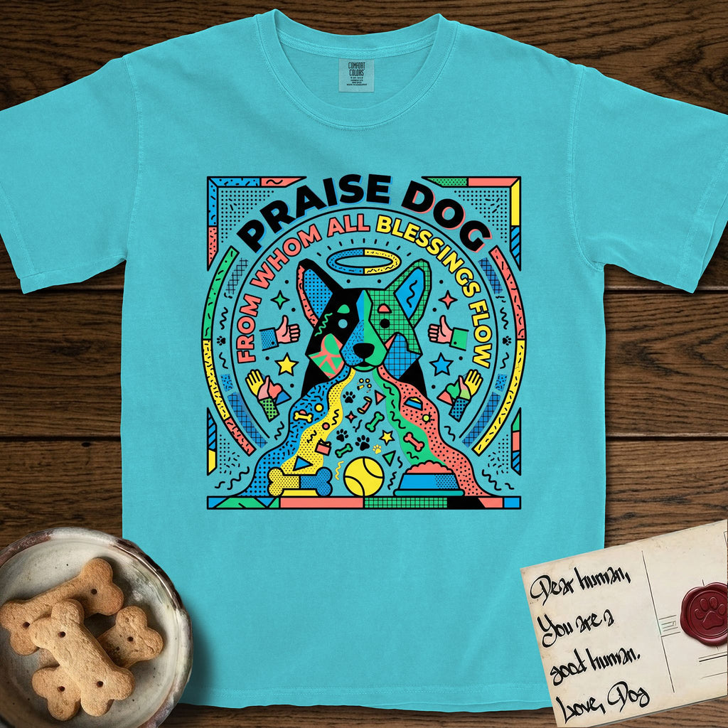 Praise Dog From Whom All Blessings Flow Australian Cattle Dog T-Shirt flat lay in Lagoon Blue, featuring a neon pop-art illustration of an abstract Australian Cattle Dog with bold outlined "Praise Dog From Whom All Blessings Flow" lettering.