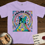 Praise Dog From Whom All Blessings Flow Australian Cattle Dog T-Shirt flat lay in Orchid, featuring a neon pop-art illustration of an abstract Australian Cattle Dog with bold outlined "Praise Dog From Whom All Blessings Flow" lettering.