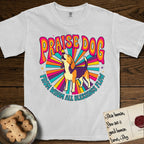 Praise Dog From Whom All Blessings Flow Beagle T-Shirt flat lay in White, featuring a groovy psychedelic sunburst design with a Beagle howling skyward at the center and the words Praise Dog From Whom All Blessings Flow in rainbow bubble letters.