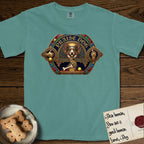 Praise Dog From Whom All Blessings Flow Corgi T-Shirt flat lay in Blue Spruce, featuring a jeweled baroque throne emblem with a Corgi at center, a golden gemstone frame, raised golden hands in blessing, and the words Praise Dog.