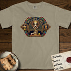 Praise Dog From Whom All Blessings Flow Corgi T-Shirt flat lay in Khaki, featuring a jeweled baroque throne emblem with a Corgi at center, a golden gemstone frame, raised golden hands in blessing, and the words Praise Dog.