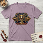 Praise Dog From Whom All Blessings Flow Corgi T-Shirt flat lay in Paragon, featuring a jeweled baroque throne emblem with a Corgi at center, a golden gemstone frame, raised golden hands in blessing, and the words Praise Dog.
