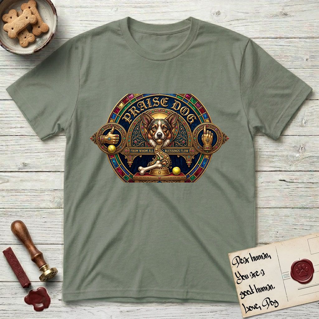 Praise Dog From Whom All Blessings Flow Corgi T-Shirt flat lay in Sage, featuring a jeweled baroque throne emblem with a Corgi at center, a golden gemstone frame, raised golden hands in blessing, and the words Praise Dog.