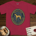 Praise Dog From Whom All Blessings Flow Galgo T-Shirt flat lay in Chili, featuring a gold and navy oval medallion with a brindle Galgo standing in profile over silver filigree vines, a knotwork border, and the words Praise Dog From Whom All Blessings Flow.