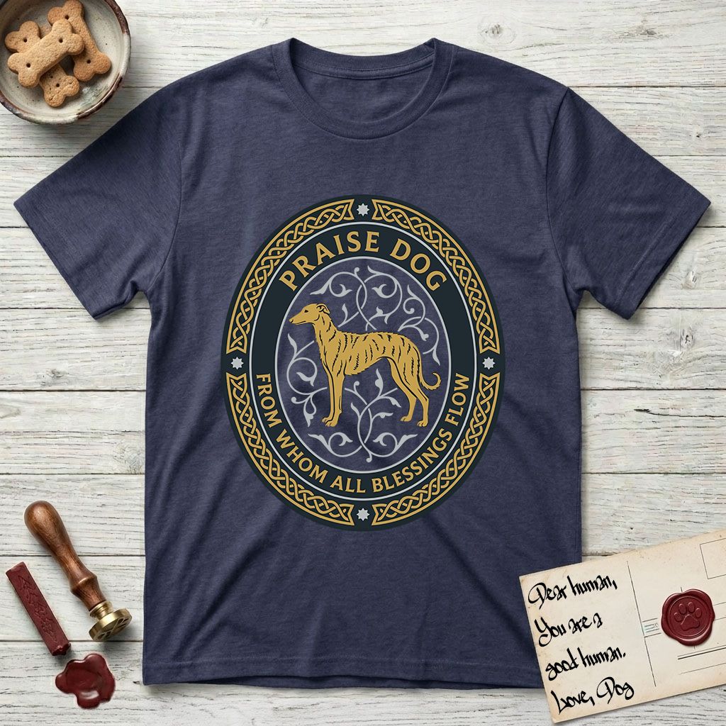 Praise Dog From Whom All Blessings Flow Galgo T-Shirt flat lay in Navy, featuring a gold and navy oval medallion with a brindle Galgo standing in profile over silver filigree vines, a knotwork border, and the words Praise Dog From Whom All Blessings Flow.