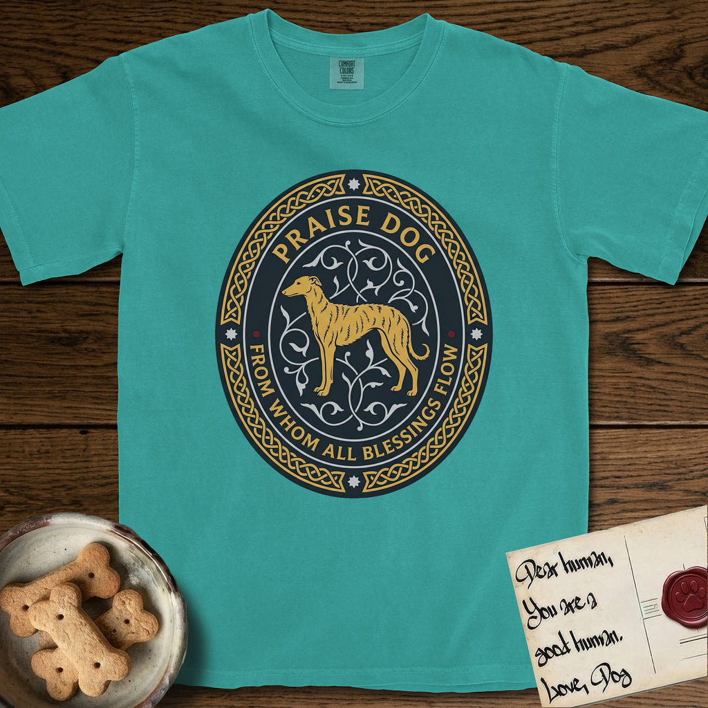 Praise Dog From Whom All Blessings Flow Galgo T-Shirt flat lay in Seafoam, featuring a gold and navy oval medallion with a brindle Galgo standing in profile over silver filigree vines, a knotwork border, and the words Praise Dog From Whom All Blessings Flow.