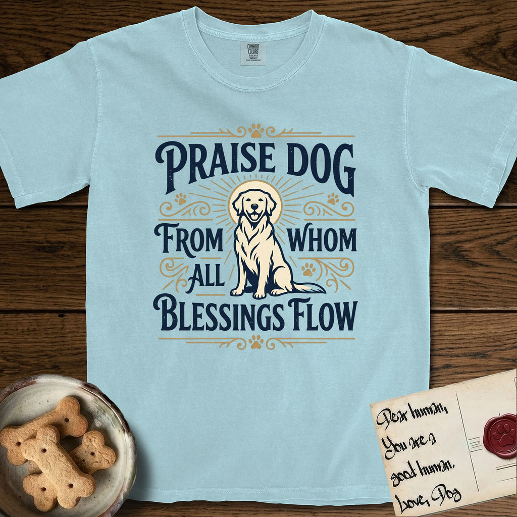 Praise Dog From Whom All Blessings Flow Golden Retriever T-Shirt flat lay in Chambray, featuring a bold Western hand-lettered "Praise Dog" design in navy and gold with a haloed Golden Retriever at center.