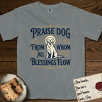 Praise Dog From Whom All Blessings Flow Golden Retriever T-Shirt flat lay in Granite, featuring a bold Western hand-lettered "Praise Dog" design in navy and gold with a haloed Golden Retriever at center.