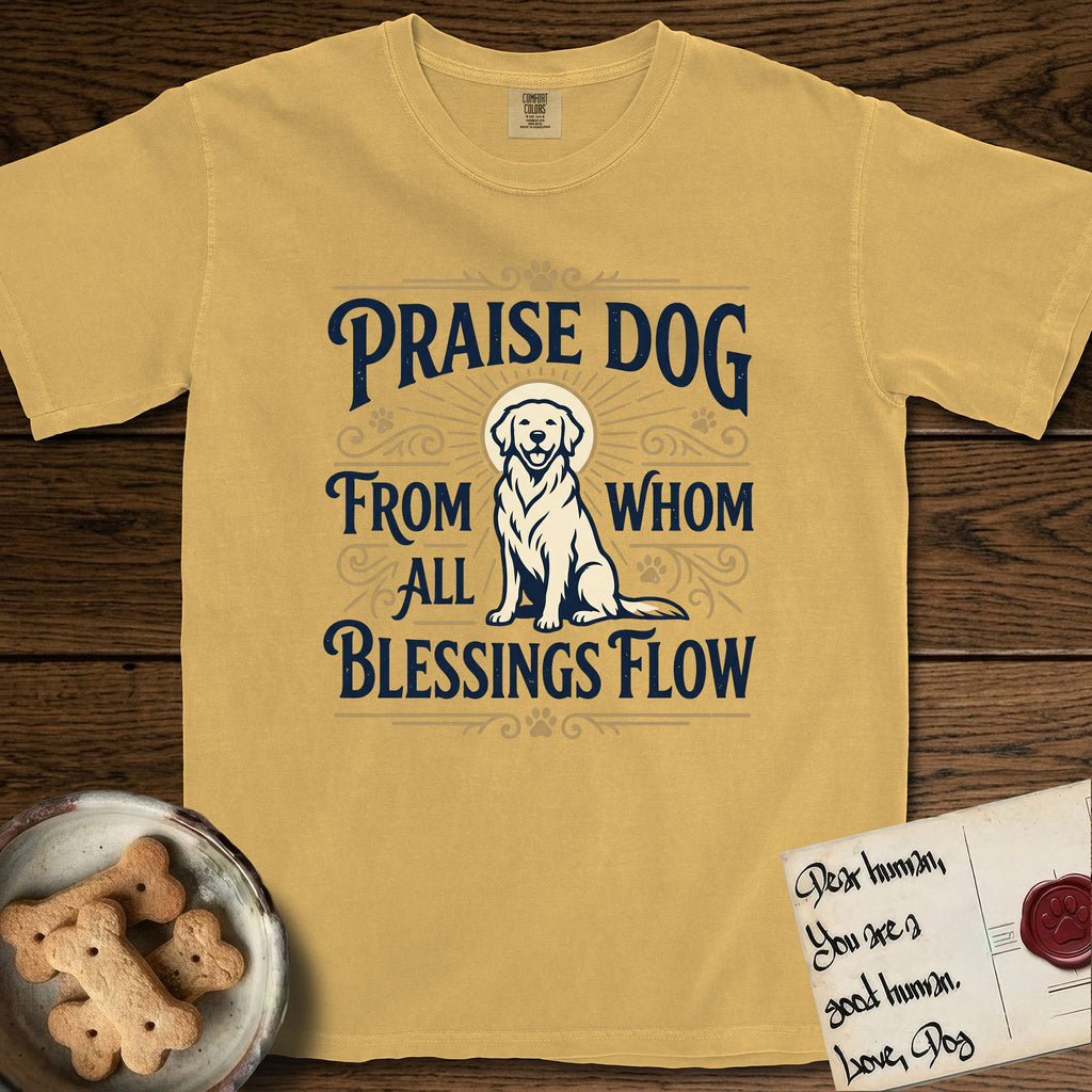 Praise Dog From Whom All Blessings Flow Golden Retriever T-Shirt flat lay in Mustard, featuring a bold Western hand-lettered "Praise Dog" design in navy and gold with a haloed Golden Retriever at center.