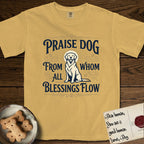 Praise Dog From Whom All Blessings Flow Golden Retriever T-Shirt flat lay in Mustard, featuring a bold Western hand-lettered "Praise Dog" design in navy and gold with a haloed Golden Retriever at center.