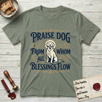 Praise Dog From Whom All Blessings Flow Golden Retriever T-Shirt flat lay in Sage, featuring a bold Western hand-lettered "Praise Dog" design in navy and gold with a haloed Golden Retriever at center.