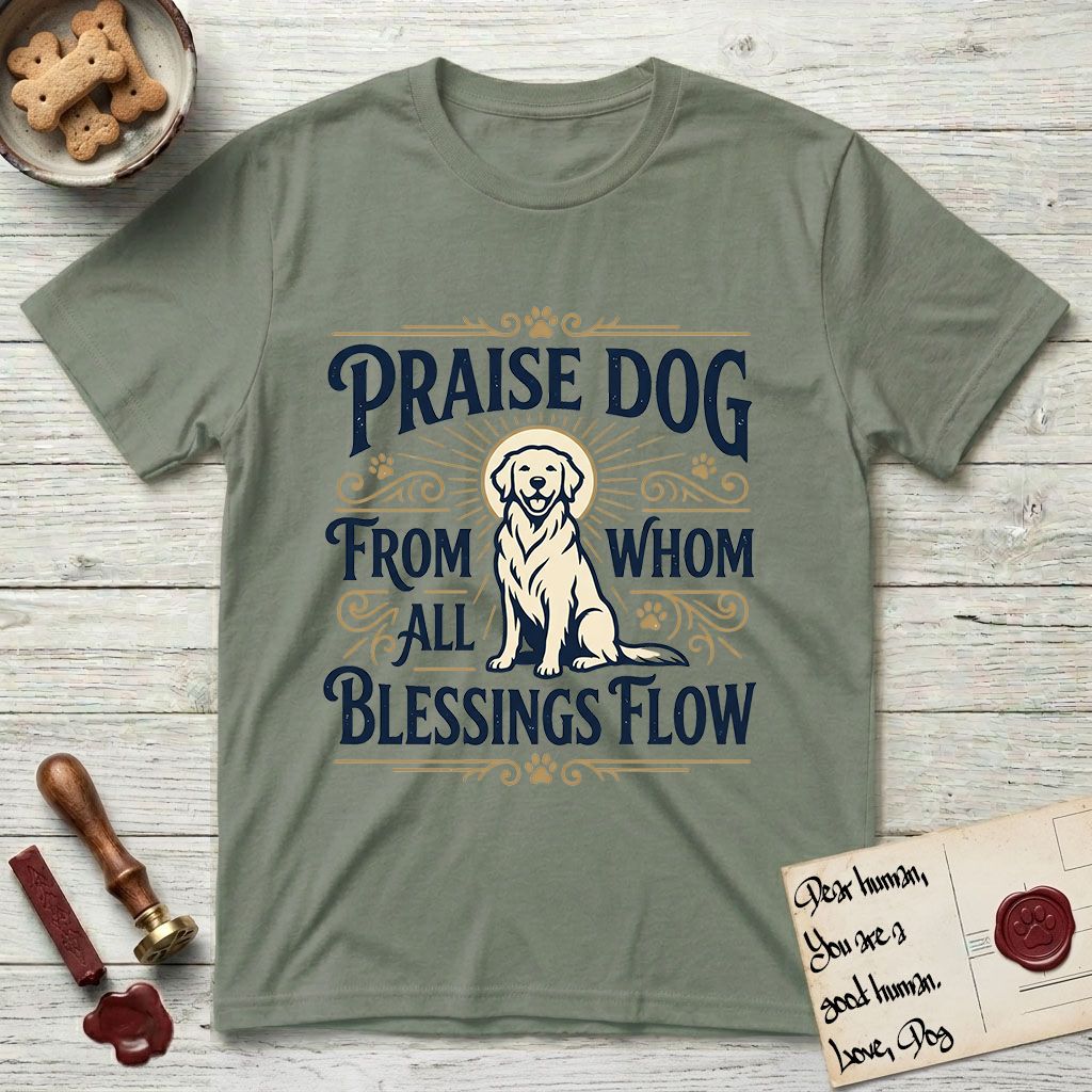 Praise Dog From Whom All Blessings Flow Golden Retriever T-Shirt flat lay in Sage, featuring a bold Western hand-lettered "Praise Dog" design in navy and gold with a haloed Golden Retriever at center.