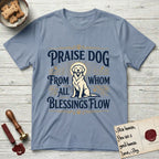 Praise Dog From Whom All Blessings Flow Golden Retriever T-Shirt flat lay in Stone Blue, featuring a bold Western hand-lettered "Praise Dog" design in navy and gold with a haloed Golden Retriever at center.
