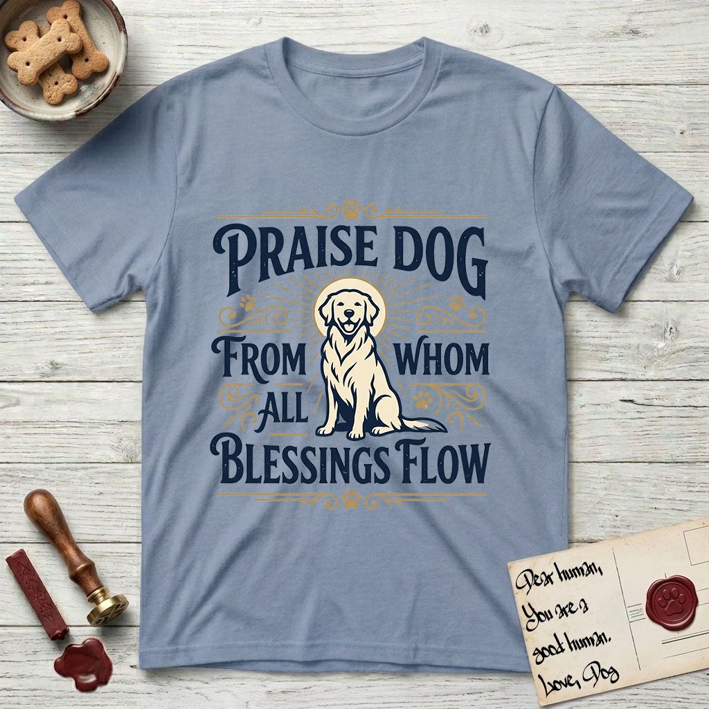 Praise Dog From Whom All Blessings Flow Golden Retriever T-Shirt flat lay in Stone Blue, featuring a bold Western hand-lettered "Praise Dog" design in navy and gold with a haloed Golden Retriever at center.
