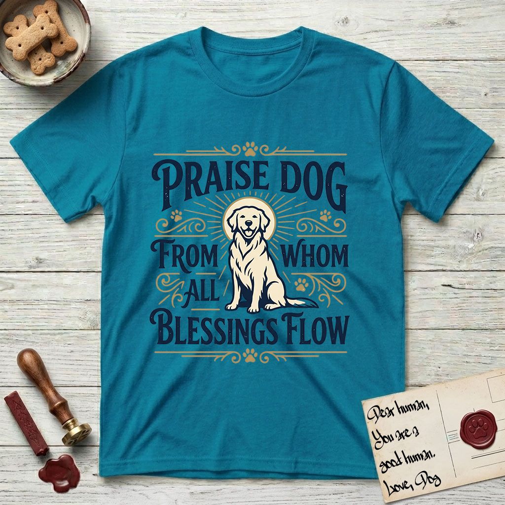 Praise Dog From Whom All Blessings Flow Golden Retriever T-Shirt flat lay in Tropical Blue, featuring a bold Western hand-lettered "Praise Dog" design in navy and gold with a haloed Golden Retriever at center.