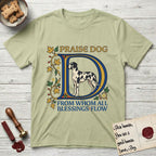 Praise Dog From Whom All Blessings Flow Great Dane T-Shirt flat lay in Pistachio, featuring an illuminated manuscript capital D in blue and gold with a harlequin Great Dane standing inside the letter and the words Praise Dog From Whom All Blessings Flow.