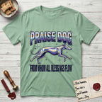 Praise Dog From Whom All Blessings Flow Greyhound T-Shirt flat lay in Mint Green, featuring a retro chrome airbrush design with a Greyhound running at full stretch among sparkle stars and the words Praise Dog From Whom All Blessings Flow in chrome sunset lettering.