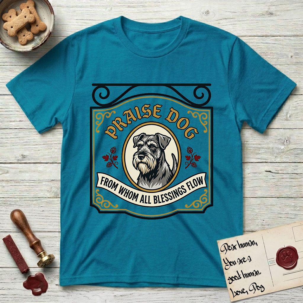 Praise Dog From Whom All Blessings Flow Schnauzer T-Shirt flat lay in Tropical Blue, featuring a vintage tavern sign with a bearded Schnauzer portrait in a gilded oval, hops sprigs, and a ribbon banner, with the words Praise Dog From Whom All Blessings Flow.