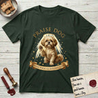 Praise Dog From Whom All Blessings Flow Shih Tzu T-Shirt flat lay in Forest Green, featuring an old-master devotional oil painting of a Shih Tzu seated with one paw raised in blessing, a floating gold halo and streaming light, a shower of small gold blessings, and gilt "Praise Dog From Whom All Blessings Flow" lettering on a ribbon scroll.