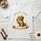 Praise Dog From Whom All Blessings Flow Shih Tzu T-Shirt flat lay in White, featuring an old-master devotional oil painting of a Shih Tzu seated with one paw raised in blessing, a floating gold halo and streaming light, a shower of small gold blessings, and gilt "Praise Dog From Whom All Blessings Flow" lettering on a ribbon scroll.