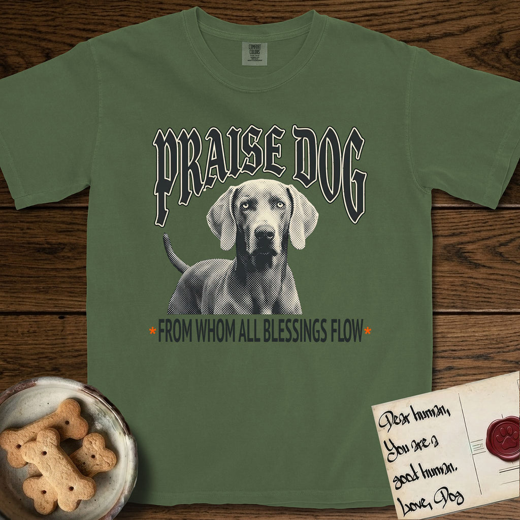 Praise Dog From Whom All Blessings Flow Weimaraner T-Shirt flat lay in Moss, featuring a gothic halftone poster with a Weimaraner staring straight ahead beneath heavy blackletter lettering and the words Praise Dog From Whom All Blessings Flow.