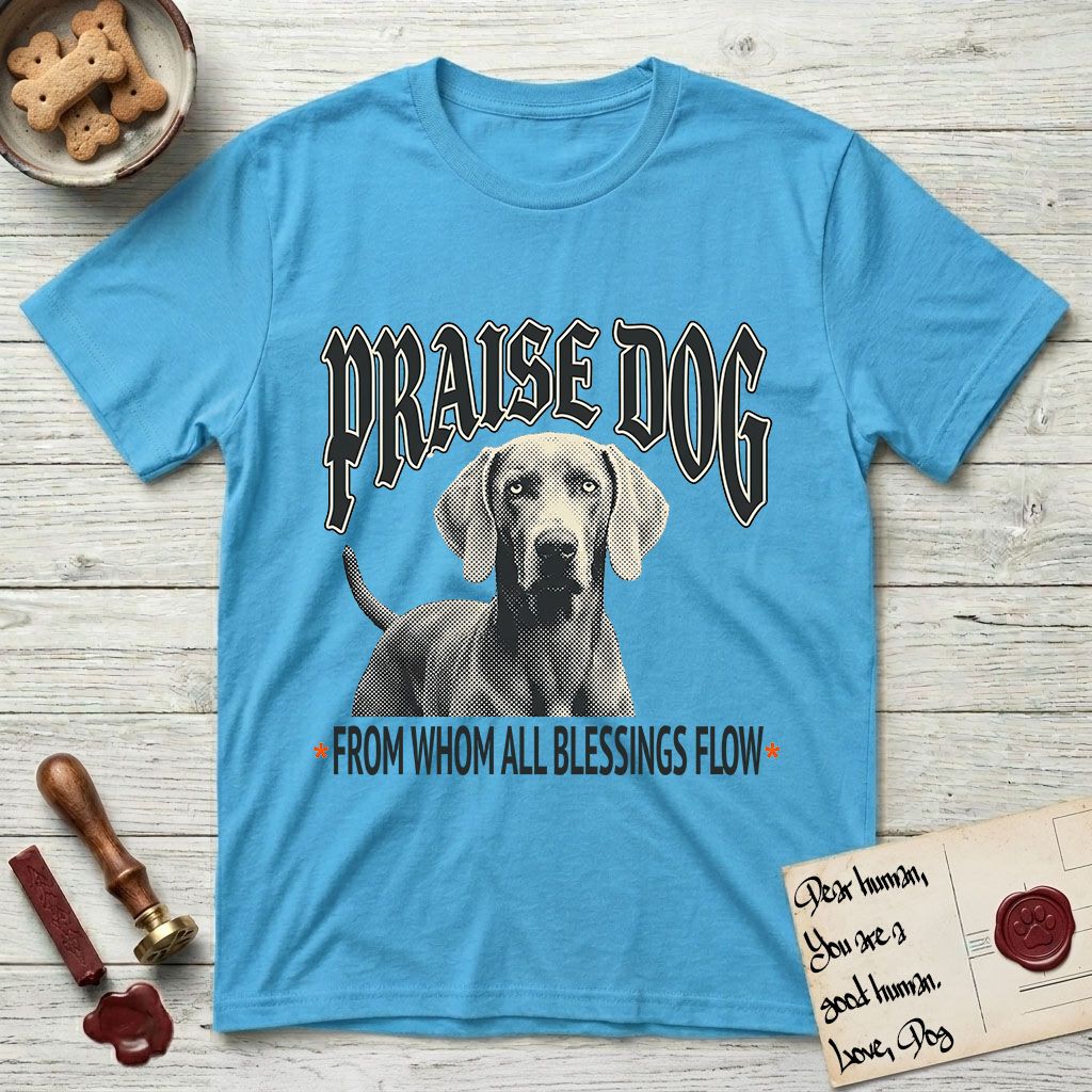 Praise Dog From Whom All Blessings Flow Weimaraner T-Shirt flat lay in Sky, featuring a gothic halftone poster with a Weimaraner staring straight ahead beneath heavy blackletter lettering and the words Praise Dog From Whom All Blessings Flow.