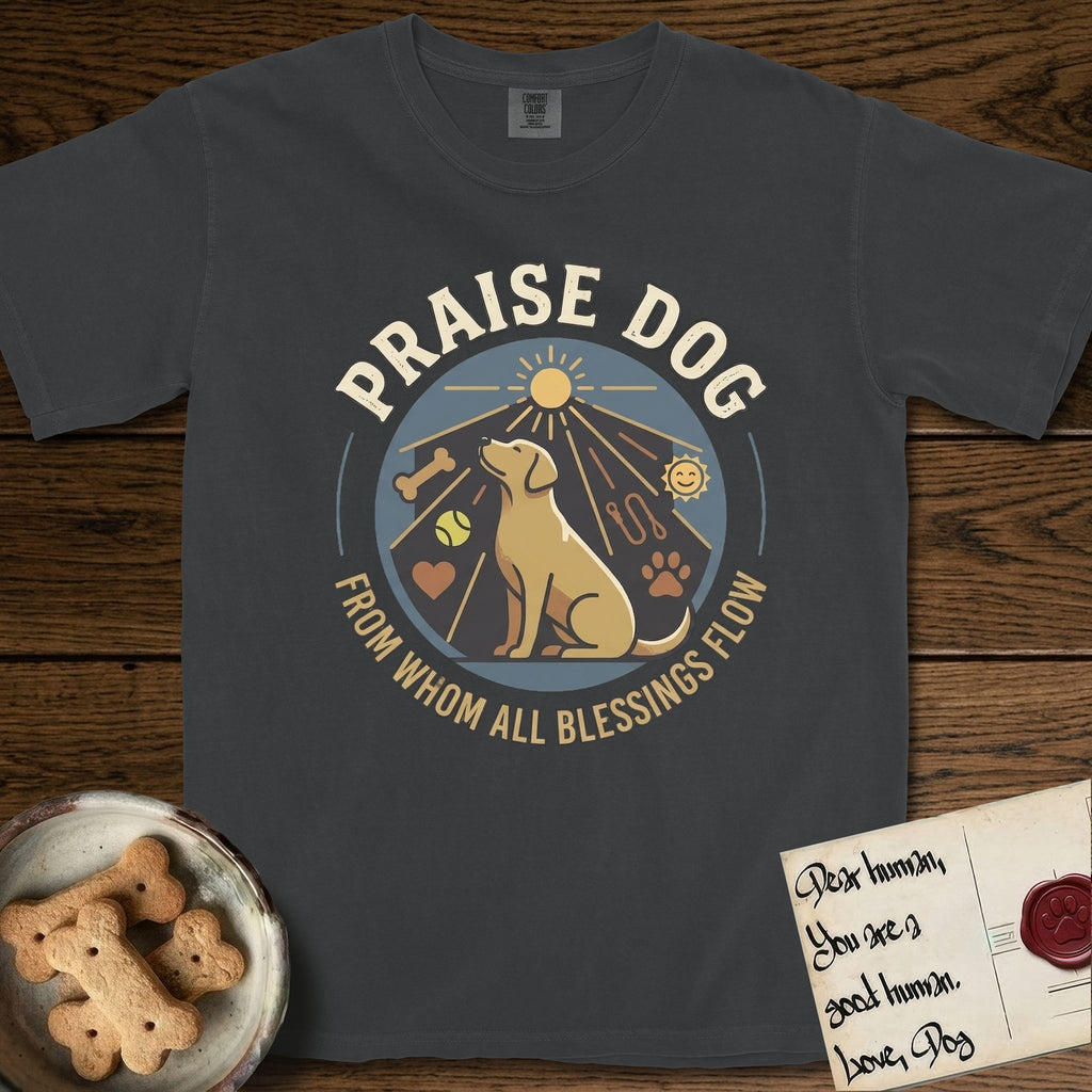 Praise Dog From Whom All Blessings Flow Yellow Lab T-Shirt flat lay in Graphite, featuring a warm vintage circular emblem with an upward-gazing Yellow Lab, a sunburst, and a devotional border of small hearts and stars.