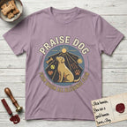 Praise Dog From Whom All Blessings Flow Yellow Lab T-Shirt flat lay in Paragon, featuring a warm vintage circular emblem with an upward-gazing Yellow Lab, a sunburst, and a devotional border of small hearts and stars.