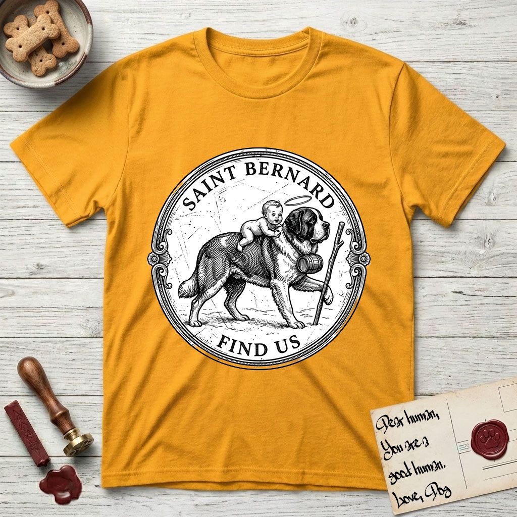 Patron Saint Medallion Saint Bernard T-Shirt flat lay in Gold, featuring a vintage engraving coin medallion of a haloed Saint Bernard carrying a child across a mountain pass, with the petition FIND US.