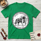 Patron Saint Medallion Saint Bernard T-Shirt flat lay in Irish Green, featuring a vintage engraving coin medallion of a haloed Saint Bernard carrying a child across a mountain pass, with the petition FIND US.