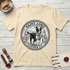 Patron Saint Medallion Saint Lobo T-Shirt flat lay in Natural, featuring a vintage engraving coin medallion of haloed Saint Lobo running across open ground, with the petition GATHER US.