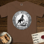 Patron Saint Medallion Saint Meatball T-Shirt flat lay in Espresso, featuring a vintage engraving coin medallion of a haloed Doberman rising on his hind legs, with the petition DEFEND US.