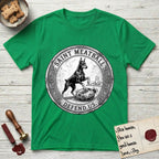 Patron Saint Medallion Saint Meatball T-Shirt flat lay in Irish Green, featuring a vintage engraving coin medallion of a haloed Doberman rising on his hind legs, with the petition DEFEND US.