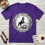 Patron Saint Medallion Saint Meatball T-Shirt flat lay in Purple, featuring a vintage engraving coin medallion of a haloed Doberman rising on his hind legs, with the petition DEFEND US.
