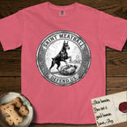Patron Saint Medallion Saint Meatball T-Shirt flat lay in Watermelon, featuring a vintage engraving coin medallion of a haloed Doberman rising on his hind legs, with the petition DEFEND US.