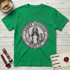 Patron Saint Medallion Saint Noodles T-Shirt flat lay in Irish Green, featuring a vintage engraving coin medallion of a haloed Basset Hound with a staff and a child at her side, with the petition GUIDE US.