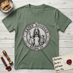 Patron Saint Medallion Saint Noodles T-Shirt flat lay in Military Green, featuring a vintage engraving coin medallion of a haloed Basset Hound with a staff and a child at her side, with the petition GUIDE US.