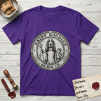 Patron Saint Medallion Saint Noodles T-Shirt flat lay in Purple, featuring a vintage engraving coin medallion of a haloed Basset Hound with a staff and a child at her side, with the petition GUIDE US.